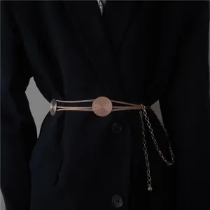 Exquisite rose gold metal chain belt, detail view of waist accessory for suits and dresses.