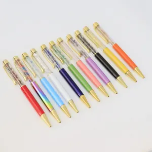 Colorful crystal stone ballpoint pens detail view, refillable metal office stationery.