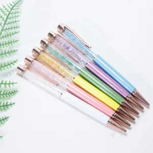 Colorful crystal gemstone ballpoint pens set with rose gold trim and sparkling decorative stones.