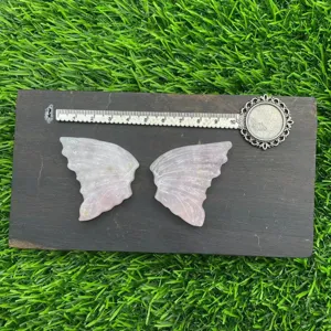 Detailed view of natural pink crystal butterfly wings crystal specimen measuring ten cm.
