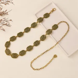 Detailed view of the vintage metal waist chain with delicate hollow carved links for women.
