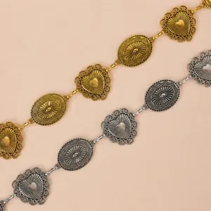 Vintage metallic waist chain featuring ornate heart and oval links in gold and silver.