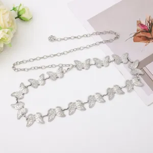 Detail view of the retro silver butterfly waist chain, perfect bohemian dress accessory belt.