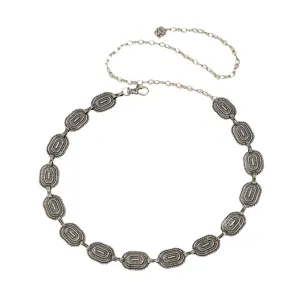 Vintage metal waist chain for women, retro carved oval link belt, adjustable body jewelry accessory.