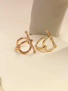 Close-up detail of metal scarf ring with chic knotted design, stylish accessory for small scarves.