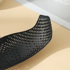 Detail view of black anti-slip hijab headband with breathable holes and grip dots.