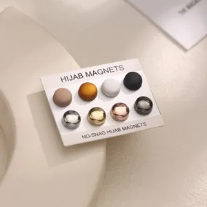 Hijab magnets set detail view, showing 8 colorful magnetic pins for secure scarves.
