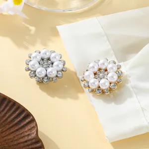 Detailed view of exquisite floral button covers with faux pearls and sparkling rhinestones.