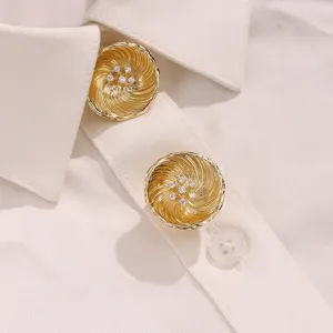 Detailed close-up shot of gold-plated rhinestone button covers, elegant shirt accessory decor.