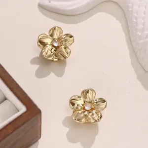 Gold flower button covers with sparkling central zircon, elegant metal shirt cuff accessory.