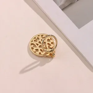 Detail view of gold alloy cutout scarf ring, elegant shawl accessory for daily wear and styling.