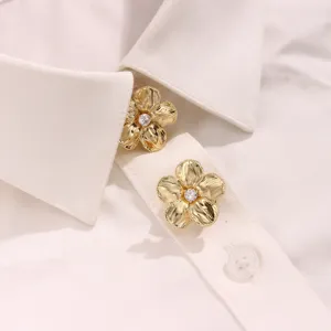 Exquisite gold-tone five-petal flower button cover detail with sparkling center zircon.