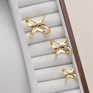 Gold X-shaped scarf buckle metal ring clip set for women shawls and stylish accessories main view.