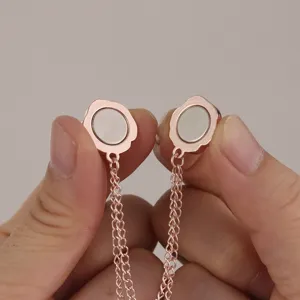 Close-up detail showing the magnetic clothing clip mechanism and metal chain link structure.