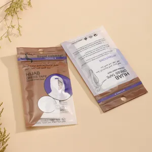 Close up of double sided hijab dress tape packaging bags, detailing secure clothing accessories.