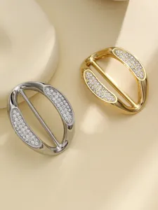 Detailed view of metal rhinestone scarf buckles in gold and silver, perfect for t-shirt hem styling.