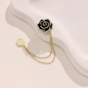 Exquisite camellia magnetic brooch with double chains, elegant black rhinestone pin.