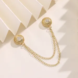 Vintage gold magnetic brooch clip with double chain, elegant scarf and shawl accessory.