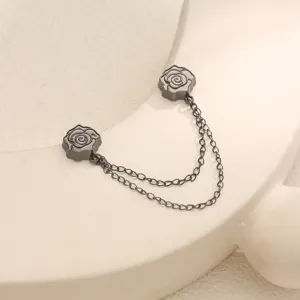 Close-up detail of black rose magnetic anti-exposure buckle and double chain scarf clip accessory.