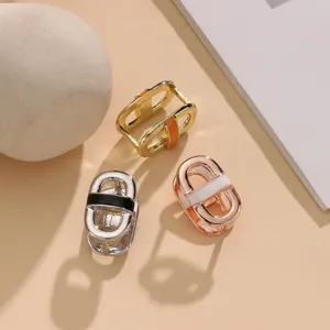 Closeup of mini alloy enamel scarf ring, hollow metal buckle detail in multiple colors.