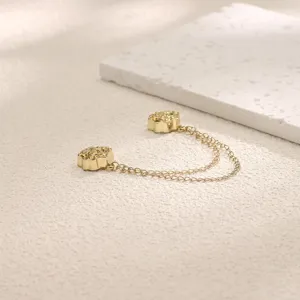 Golden rose magnetic clothing buckle detail view, featuring dual metal chains for stylish fixes.