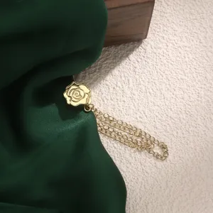 Gold rose magnetic buckle detail, elegant clothing fastener and scarf clip for secure wear.