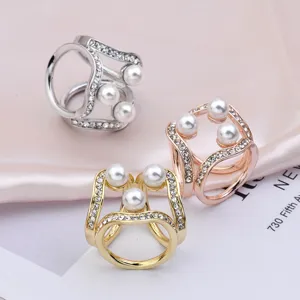 Elegant alloy triple ring scarf clip with pearls and rhinestones, versatile accessory.
