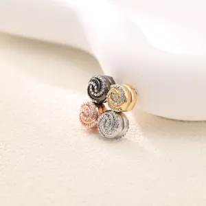 Close-up view of sparkling rhinestone magnetic buttons in four elegant metallic colors.