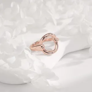 Closeup of rose gold multi-functional scarf ring buckle, perfect for T-shirt hem knots and shawls.