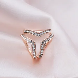 Elegant rose gold alloy triple ring silk scarf buckle with crystal rhinestones detail.