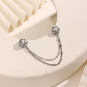 Detailed view of rhinestone magnetic cardigan clip with double chain for clothes styling.