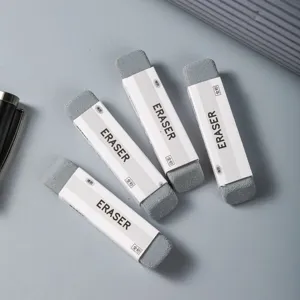 Detail shot of grey all-sand erasers with paper sleeves, stationery supply for students.