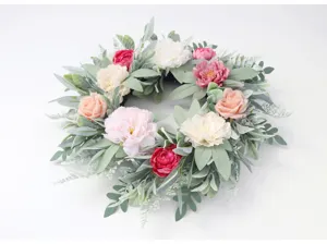 Detailed view of artificial peony rose flower wreath, wedding home wall hanging decor.