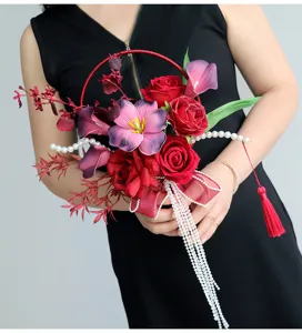 Exquisite Chinese style artificial bridal hand bouquet with red roses, pearls and tassels.