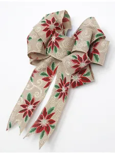 Fiocco di juta natalizio con stella di natale rossa e decorazioni dorate per albero.