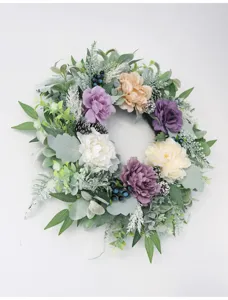 Detailed view of artificial peony and rose wreath floral wall hanging for home decor