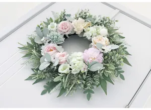 Artificial floral wreath detail, stunning peony and rose design for home wall decor.