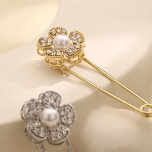 Pearl rhinestone flower brooch pin close up detail sparkling crystal fashion accessory for scarf shawl