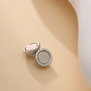 Silver magnetic snap button with classic quilted diamond pattern for scarves and clothing.