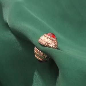 Rose gold magnetic scarf clip with red rhinestone, grid pattern detail for hijab and shawl.