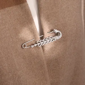 Elegant crystal peacock brooch pin, versatile scarf shawl buckle and coat accessory.