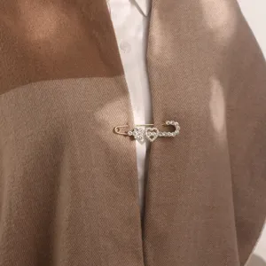 Crystal heart brooch pin for shawl scarf cape clasp, elegant metal rhinestone clothing accessory.