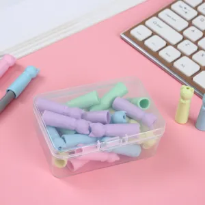 Detailed view of cute cat ear silicone pencil caps inside a clear box with pastel colors.