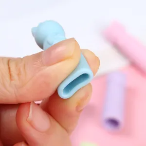 Silicone cartoon cat ear pencil cap protective cover, flexible and cute stationery accessory.