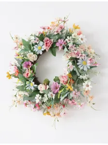 Detailed view of artificial daisy flower wreath for spring home decor and wedding party.