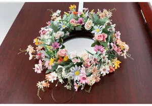 Artificial daisy flower wreath for spring door decoration, wedding and home interior display.