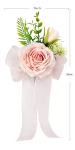 Close-up of pink artificial rose wedding pew bow with chiffon ribbon, elegant floral detail.