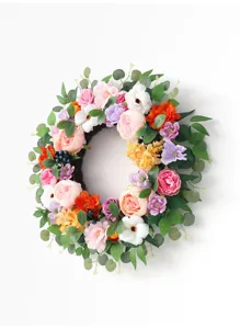 Artificial floral wreath with colorful peonies roses and eucalyptus leaves for home decor