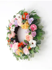 Detailed shot of colorful artificial floral wreath, perfect for home wall and wedding decor.