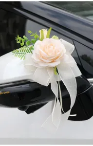 Wedding car rearview mirror flower decoration with champagne rose and white bow ribbon.